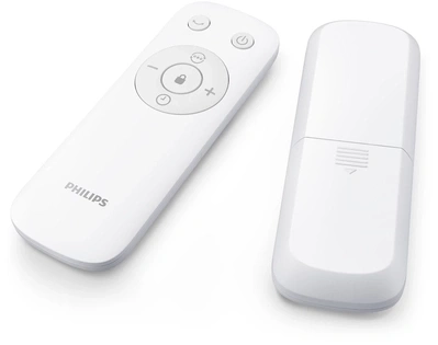 Zwei weiße Fernbedienungen mit Knöpfen und dem Philips-Logo.